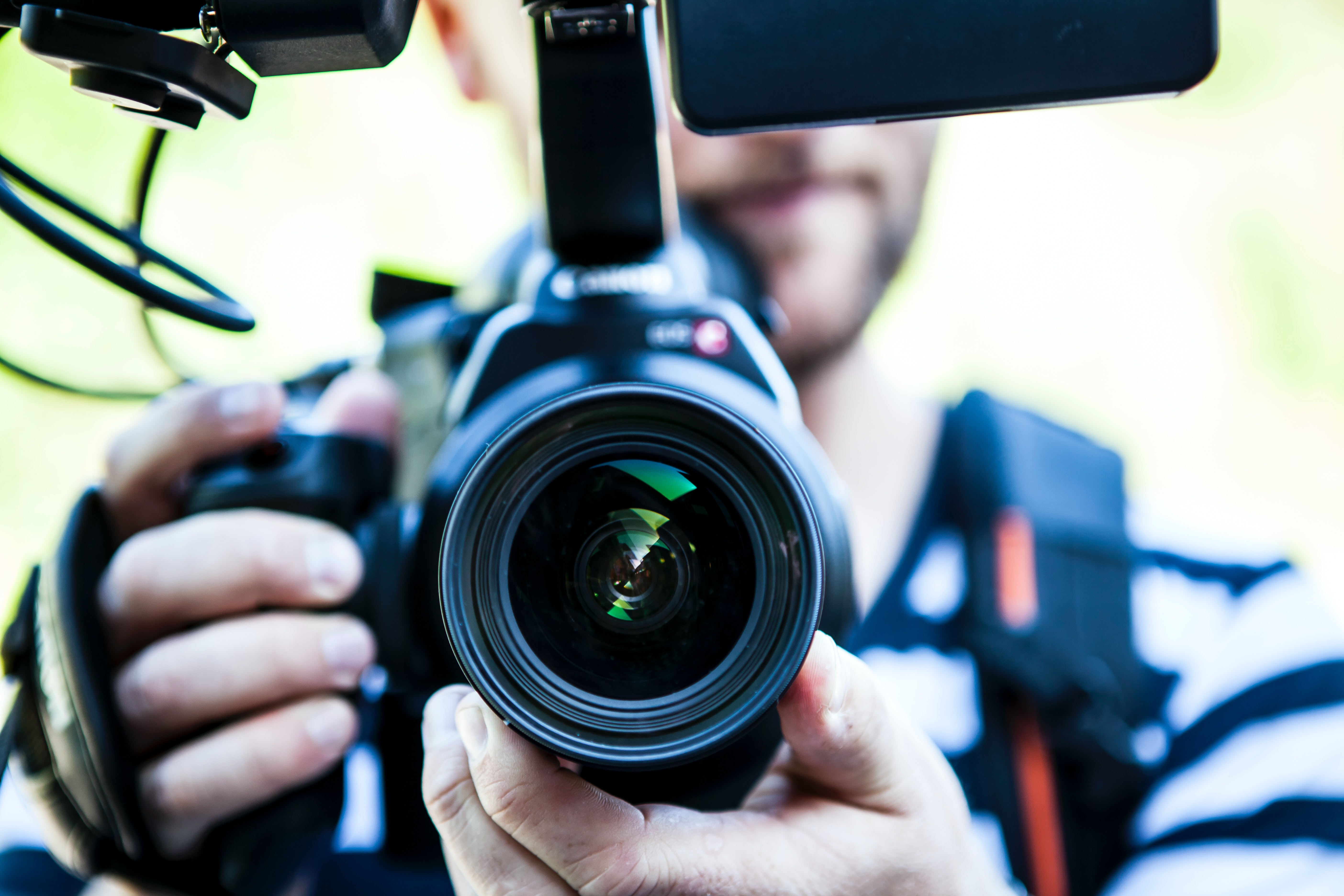 Person holding a video camera