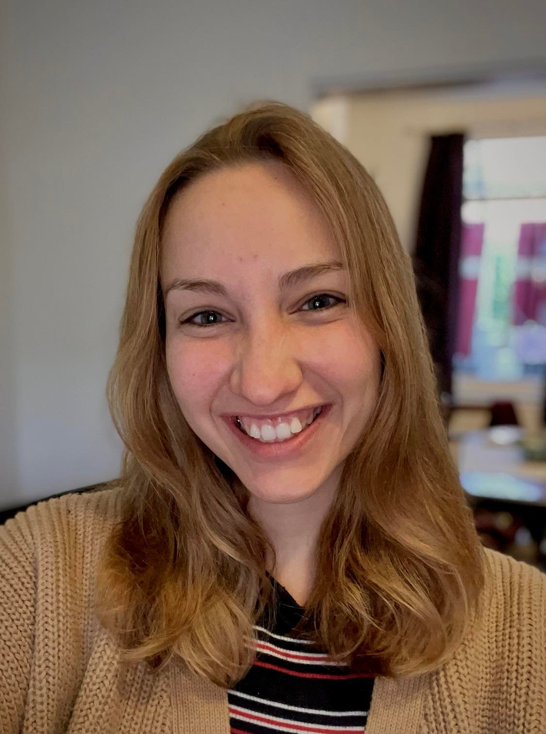 Laura, a blonde woman smiling at the camera