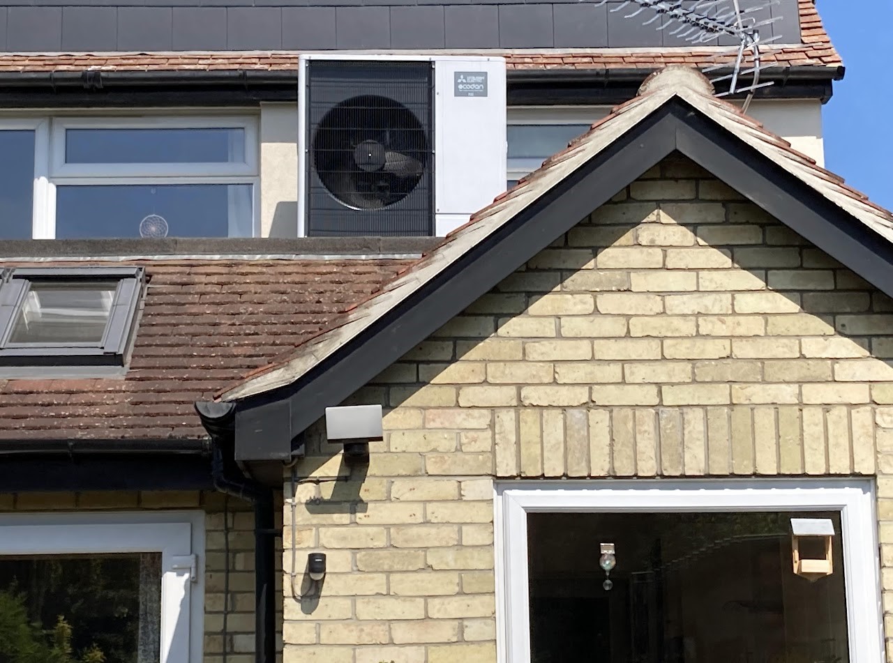 A air-source heatpump installed on a house