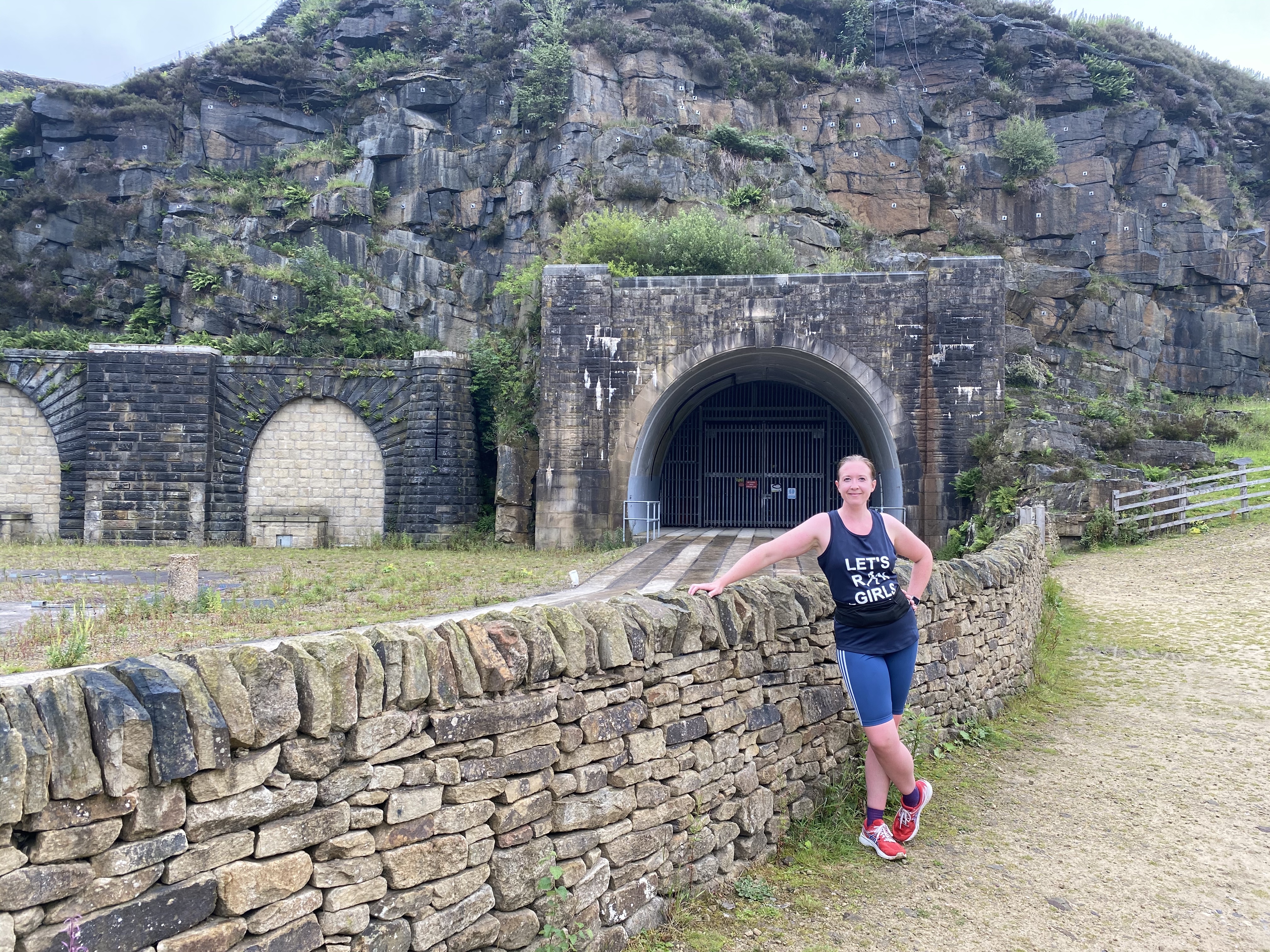 Danielle Hoyle outside the western entrance of the Woodhead Tunnels, a closed set of railway tunnels through the Pennines, linking Sheffield and Manchester. 