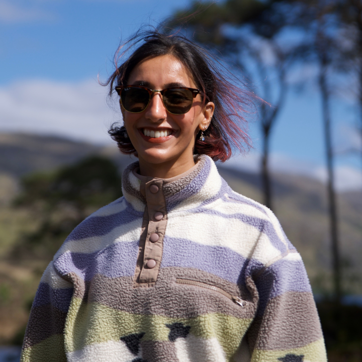 Mahrukh Shameem wearing sunglasses and a jumper with sheep on