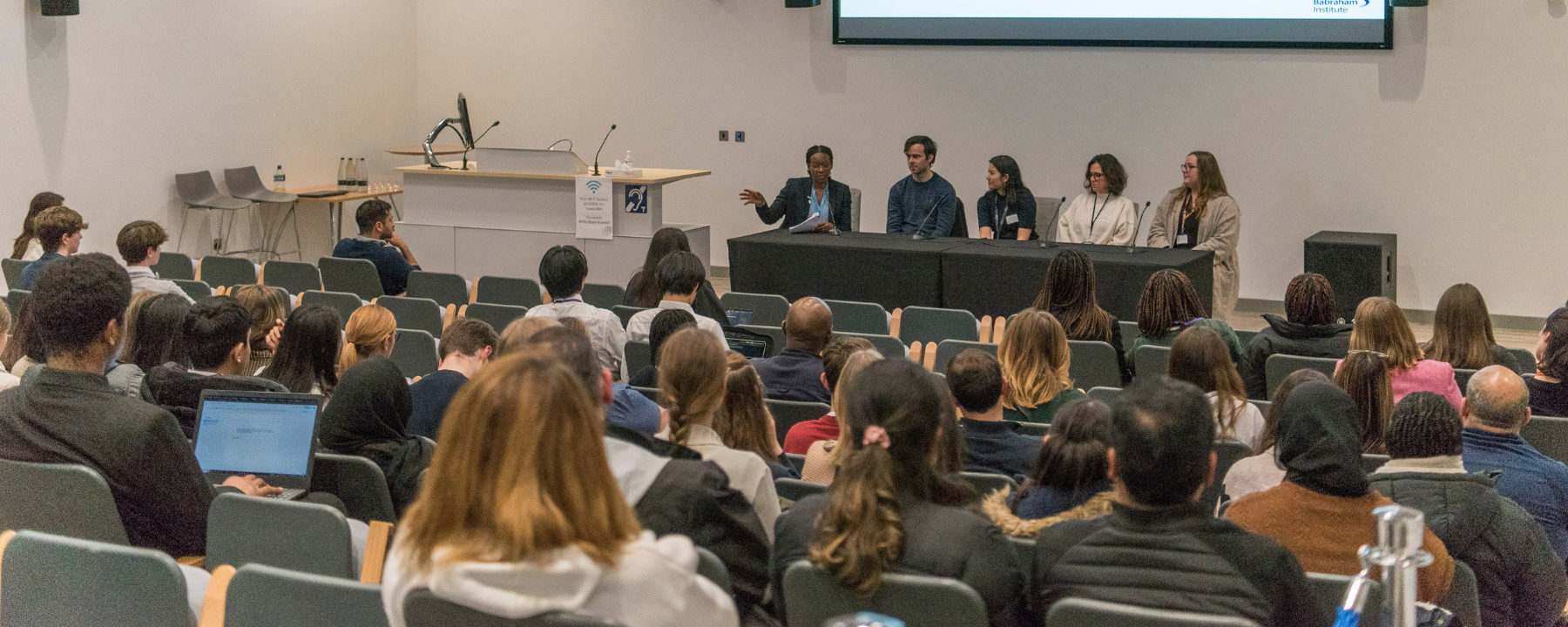 Attendees and a panel at an engagement event