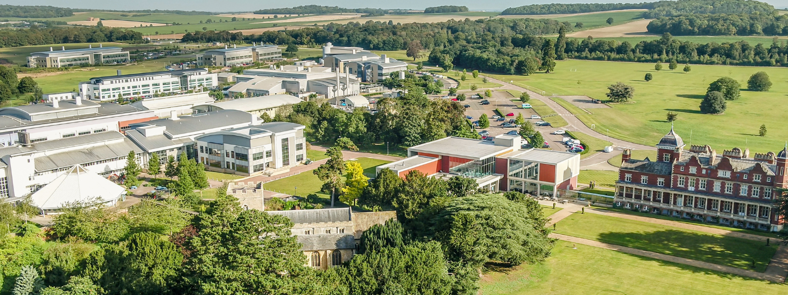 Aerial photography of the Babraham Research Campus. showing buildings and the village church.